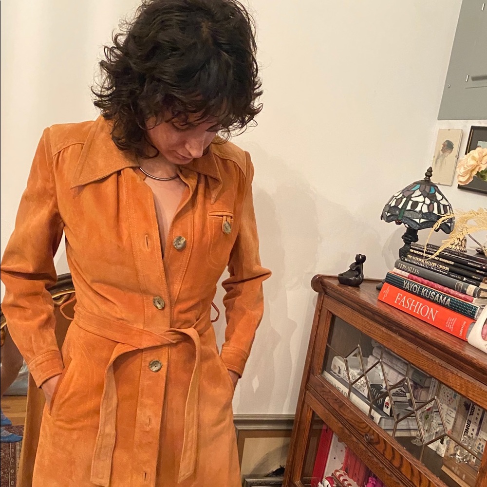 Long saddle tan leather jacket.